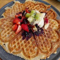 Vegan waffle with berries and fruit. at Leonardos Kafferosteri in Stockholm