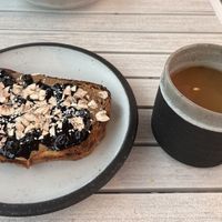 Almond delight toast, americano with oat milk  at Arvo Coffee in Toronto