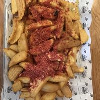 Vegan bacon bits (like the crisps) and melted cheese. Also have a vegan loaded d u ck chips and a hot sauce one which are also lovely!   at Vocation & Co in Hebden Bridge