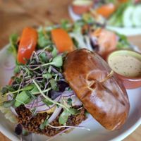 Country Fried Steak Burger with an awesome side salad at Buddha Belly Burger in Sacramento