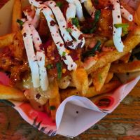 Buffalo wings on cheesy fries at Herbivorous Spark   in York