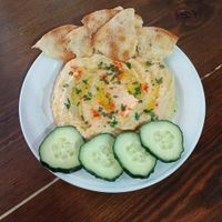 Hummus con torta de Inés Rosales y pepinos at El Patio Cocina Vegana in Genalguacil