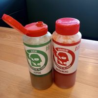 Hot sauces on tables at Mad Mex in Cameron Park