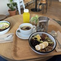 Glow Bowl left and Granola on the right. Large Americano  at Wild & The Moon - West in Amsterdam