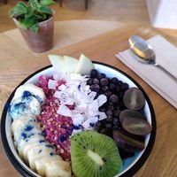 Blue bowl with pink granola at Wild & The Moon - West in Amsterdam