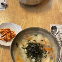 Buckwheat spicy noodles and rice cake dumpling soup with vegan kimchi  at Vegan Insa - 비건인사 in Seoul