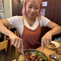 Ally stirring the bibimbap  at Vegan Insa - 비건인사 in Seoul