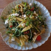 MAFALDINI PRIMAVERA: Ruffled Ribbon Pasta, Asparagus, Courgette, Cherry Tomatoes, Lemon, Herbs, Feta-Style Vegan Cheese at Victors in Alderley Edge