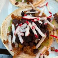 Veggie taco (brussel sprouts, beans, guacamole)  at Tacos Tequila Whiskey - 32nd Ave in Denver