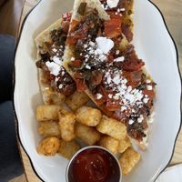 Tomato confit with tater tots  at Cafe Birdie in Edwardsville