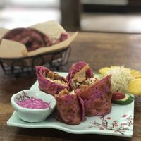 Lemon chicken red burrito with snow cake in background  at Red Dragon Fruit Burrito in Hengchun