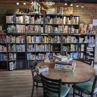Part of the inside of restaurant with board games and table  from google   at Great Oaks Tavern in Wadsworth
