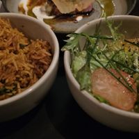 Rice and salad comes with the main course. at Maha Restaurant in Melbourne