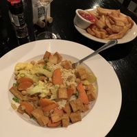 Organic tofu curry with side order of fries at Sir Edmond Halley's Restaurant and Freehouse in Charlotte