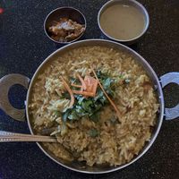 Sambar Rice (basmati rice cooked with lentils, vegetables & sambar). Subbed Mango Chutney for Raita which is not vegan. Very good. at Aroma Indian Cuisine in Bloomington