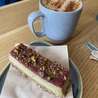 Pistachio raspberry cheesecake and dirty chai latte   at Little Collins CBD  in Dublin