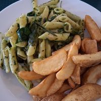 Spinach pesto pasta and chips (free side) at Seed Cafe in North West London