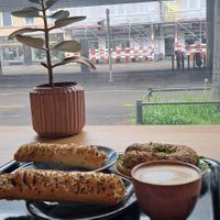 Sausage rolls, power bagel, coffee at Bakery Bakery  - ThreeOfive in Zurich