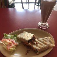 Burro de desayuno- chorizo and tofu. Strawberry milkshake with soya milk   at Om Burger Rincon Vegetariano in Zacatecas