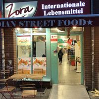 Storefront with seating area.  at Zora in Berlin