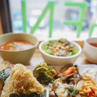 Shokujidouzen lunch set with brown rice onigiri, minestrone soup, salad, brown rice tea, and deli items.  at Genmai Cafe in Osaka