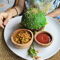 Vegan burger. Beetroot patty in a bright green spinach bun. at Wild Vegan in Ubud