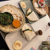Menue with filled Manakish, Tabouleh, Dips and bread  at elbēn an der Wolbecker in Muenster