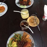 Nasi campur (front), Nasi goreng (back). pineapple juice and ice tea! everything very delicious! at Siboghana Waroeng in Ubud