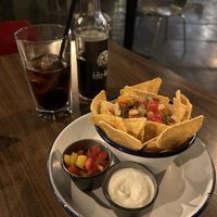 Cheesy nachos with sour cream and salsa  at The Flying Duck in Glasgow