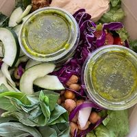 Hummus Crunch Salad: Hummus, olives, chickpeas, tomatoes, cucumbers, shredded cabbage, red onions, basil, za’atar breadcrumbs, chopped romaine, shredded kale, pesto vinaigrette at sweetgreen in Schaumburg