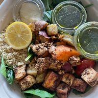 Mediterranean Mezze Warm Bowl: swap chicken for tofu, hot roasted sweet potatoes, hummus, chickpeas, olives, tomatoes, basil, warm quinoa, baby spinach, lemon squeeze, pesto vinaigrette at sweetgreen in Schaumburg