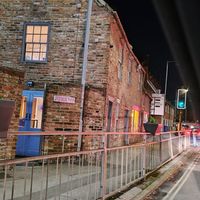 Here were come, Junk Bar! (Entrance from courtyard) at Junk Soul Smothered Bar & Grill in Beverley