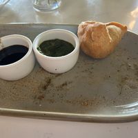 I got to excited and ate one of the 2 simosas before taking a picture. I have no regrets. 😆  at Naan At Northwoods in North Charleston