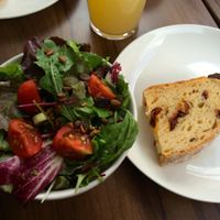 Lunch menu: side salad and bread with huge dried tomato chunks! Yum! at Gratitude Restaurant in Munich
