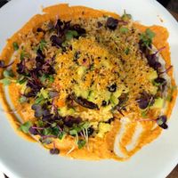 Main lunch dish with grilled avo, yummy sauce, hummus...  at Gratitude Restaurant in Munich