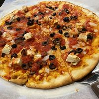 Vegan chicken with black olives and onions…vegan cheese too!  at Congress Pizza in Ishpeming