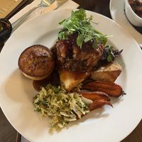 Vegan Nut Roast with Rosemary & Garlic Roast Potatoes, Maple Roasted Carrot, Braised Red Cabbage, Seasonal Greens, Vegan Yorkshire Pudding & Gravy  at The Lamplighter in Northampton