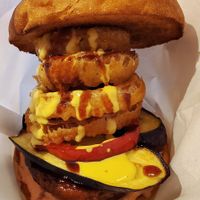 Kamakura BBQ Burger. As big and voluminous as a giant Buddha. Topped with onion rings, fried eggplant, and more. at Luna Burger  in Kamakura