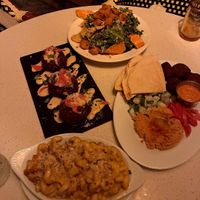 clockwise from top: kale ceasar, falafel plate, full size mac n cheese, and mac n cheese croquettes at Fortune in Portland