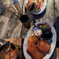 Soup, potatoe pancakes with jam and salad, beyond burger with fries at Valhalla Wine & Coffee, kafejnīca in Liepaja