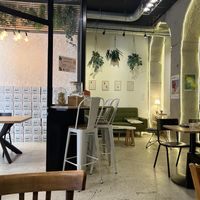 The Great Wall of minor figures oat milk boxes! Also the chill interiors  at ZEITGEIST Café in Lyon