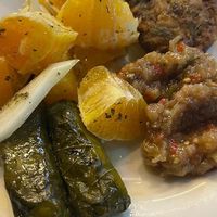 Stuffed vine leaves, orange salad, zucchini balls and eggplant salad  at To Steki sti Gonia in Himare