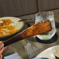 The wood holding the "lamb" made of seitan and jackfruit together at Petiole Cafe in Janabiyah