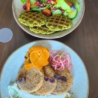 Falafel waffles. Hashbrown pancakes with 'salmon' and whipped 'feta'. at Petiole Cafe in Janabiyah