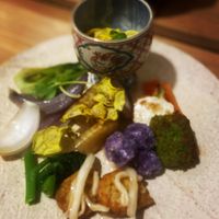 The main dish, various vegetables plate. Each vegetable is cooked in various ways. Some are spicy, some are savory.  at Tachibana Saryou in Kisarazu