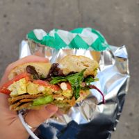 Eggs salad, bacon, tomatoes, Avocados, greens, garlic spread. Highly recommend! at Yough in Brooklyn