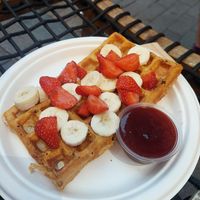 Belgian waffle with fresh banana and strawberries, jam on the side. 3/5. at Cafe Järntorget  in Stockholm