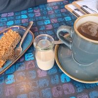 Tea with oat milk and an apple-cinnemon-flapjack at The Old Butchers in Lochcarron