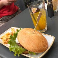 Vegan burger with fries and mango lemonade at Brunch Republic  in Padua