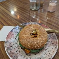 Vegan bagel with hummus, sweet potato, tomato and spinach at MOLA Cafetería Bio in Granada